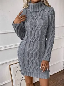 Detail of grey cable-knit turtleneck sweater dress showing texture and slim fit