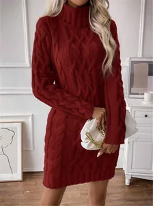 Close-up of a stylish dark red high-neck cable-knit sweater dress worn by a model