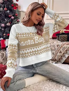 Close-up of a festive white and tan Christmas sweater featuring Santa Baby knit text