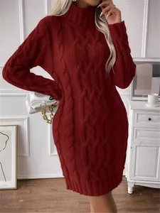 Detail showing the burgundy cable knit pattern of a slim-fit high neck sweater dress.