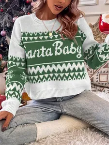 Close-up of green and white Christmas sweater featuring 'Santa Baby' text and snowflake patterns
