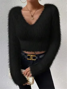 Detailed view of the fuzzy plush texture on a black V-neck cropped sweater