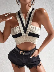 Detailed view of a chic color-block halter-neck knit crop top with a ribbed texture.