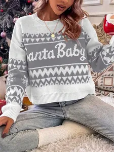 Close-up detail of knitted Santa Baby Christmas sweater with festive pattern