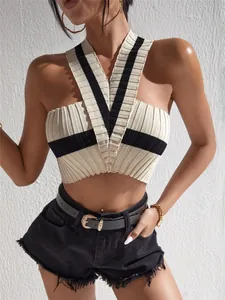 Detailed view of women's color-block halter knitted crop top with ribbed texture
