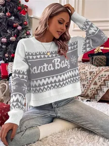 Detail view of festive Christmas knit sweater with Santa Baby text and snowflake motifs