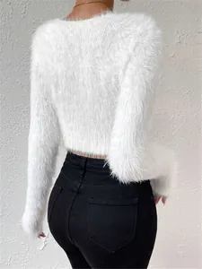 Detailed back view of a white fuzzy cropped sweater highlighting its soft plush texture
