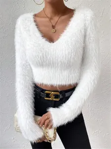 Close-up of white fuzzy V-neck cropped sweater showing its soft textured knit fabric