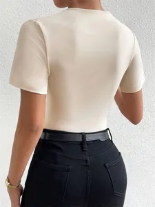 Detailed back view of a slim-fit short-sleeved beige bodysuit for women with a round neck