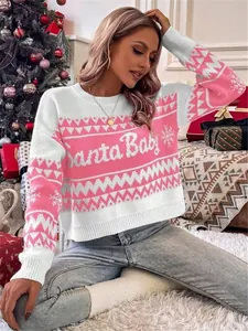 Women's pink and white Santa Baby Christmas knit sweater in a cozy festive setting