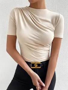 Close-up view of a cream-colored ruched short sleeve slim fit bodysuit for women