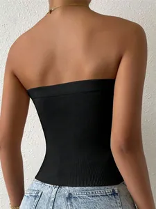 Back view of black slim fit knitted tube top showing texture and backless design