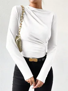 Close-up view of white ruched long sleeve bodysuit showing slim fit and elegant fabric texture