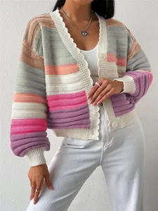 Close-up detail of a vibrant rainbow striped knit cardigan featuring puff lantern sleeves