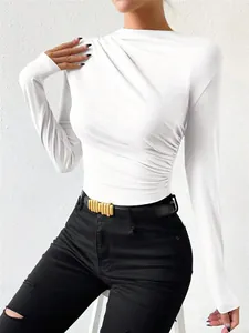 Detailed view of white long-sleeved ruched bodysuit with slim fit and elegant draping