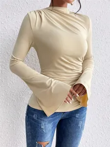 Close-up of women's ruched slim fit top featuring elegant flared bell sleeves