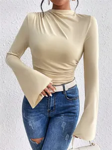 Detailed view of the ruched shoulder and flared sleeve on a beige mock neck slim t-shirt.