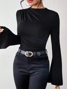 Detail of black women's slim T-shirt with mock neck and elegant bell sleeves