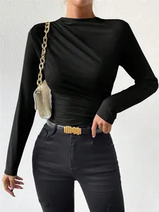 Detail view of a black slim-fit long-sleeve bodysuit with elegant shoulder ruching