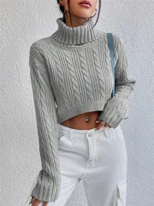 Detailed view showing the soft grey cable-knit texture of a stylish cropped turtleneck sweater