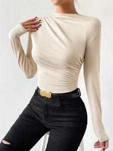 Elegant beige long-sleeve bodysuit featuring stylish ruched details and a slim fit design.