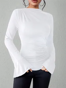 Detail of a white slim fit T-shirt featuring ruched sides and stylish bell sleeves.