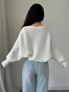 Detailed back view of a loose-fit white knitted cardigan with stylish batwing sleeves.