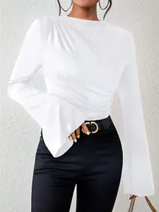 Detail view of white stand collar T-shirt featuring elegant bell sleeves and pleated front