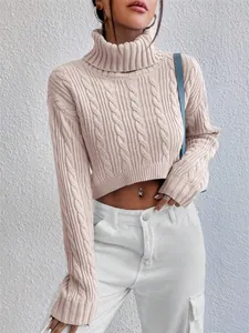 Close-up detail of a pink turtleneck cable knit cropped sweater with long sleeves for women