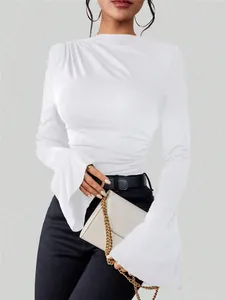 Detail shot of white ruched T-shirt with elegant flared bell sleeves for stylish women
