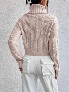 Close-up back view of women's pink cable knit turtleneck sweater with high collar