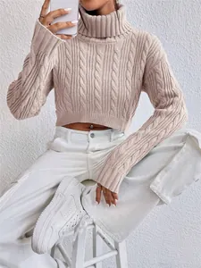 Close-up view of a beige cable-knit cropped turtleneck sweater for women.