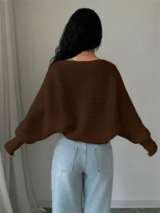 Back view of a loose brown knitted short cardigan sweater for women.