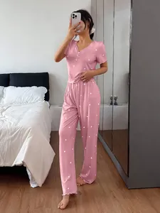 Detailed view of pink ribbed heart-patterned short-sleeve pajama set for women