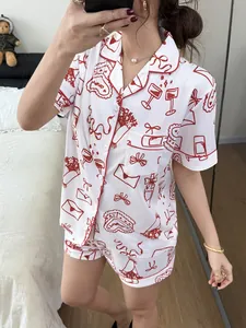A detailed mirror selfie view of summer women's short-sleeved pajama set with red heart print