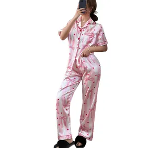 Comfortable pink and white striped women's pajama set with bow and heart prints