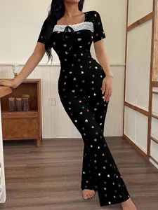 Sexy women's black loungewear set with colorful heart patterns and delicate white lace trim.