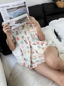 Close-up of women's Easter rabbit print pajamas featuring a short sleeve button-up shirt