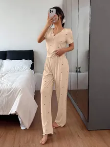 Elegant women's heart print ribbed pajama set featuring short sleeves and long trousers