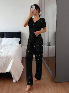 Women's black ribbed short sleeve pajama set featuring cute white heart patterns