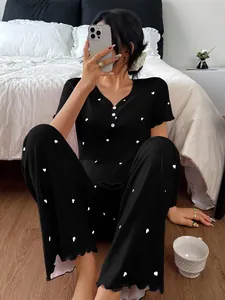 Cozy black ribbed pajama set with heart print featuring short sleeves and long pants