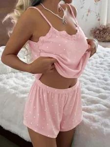 Detail view of stylish pink heart-pattern ribbed pajama set with delicate lace trim.