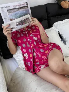Detailed macro view of magenta women's pajama set featuring cute rabbit and egg patterns