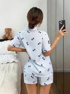 Back view of women's heart striped pajama set with short sleeves and lapel collar