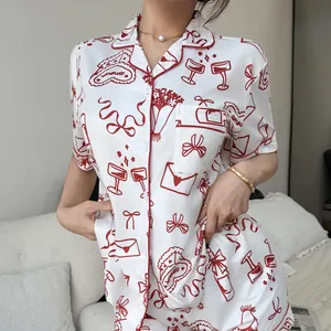 Stylish white short-sleeve pajamas set with red heart and ribbon pattern for women