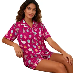 Women's short-sleeved button-down pajama set featuring colorful Easter bunny and egg prints