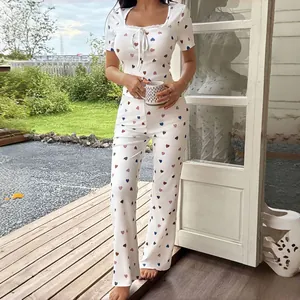 Elegant white heart pattern two-piece pajama set with lace trim and comfy short sleeves