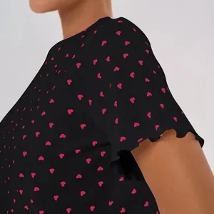 Women's black cotton pajama top with red heart print and ruffled lettuce edges