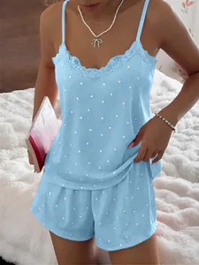 Close-up detail of blue ribbed pajama set with lace trim and white heart pattern