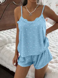 Close-up of women's blue heart print pajama set with lace trim and ribbed fabric detail